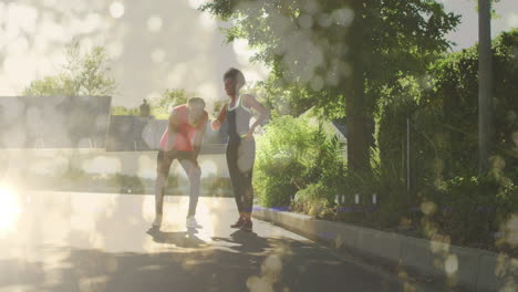 animación de puntos de luz sobre una pareja afroamericana corriendo, cámara lenta