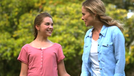 mother and daughter walking together