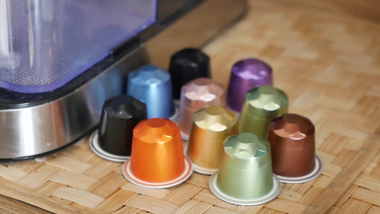 Colorful Coffee Capsules Arranged on a Wooden Surface