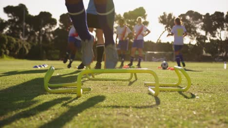 Female-soccer-team-training-on-soccer-field-4k