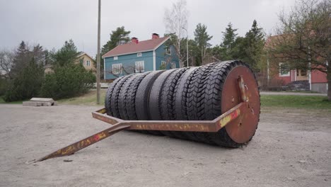 homemade land roller on a gravel field