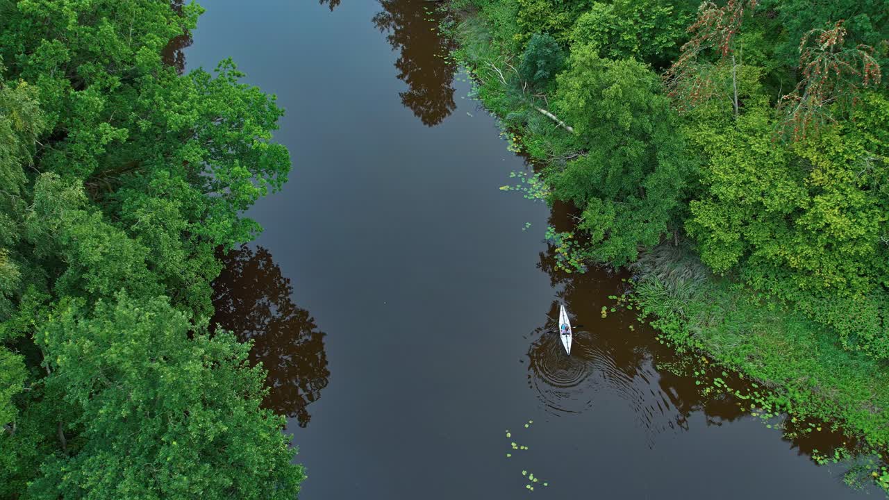 Ascending Aerial of Peaceful Paddling on Dalbergsan River, Asebro, Dalsland