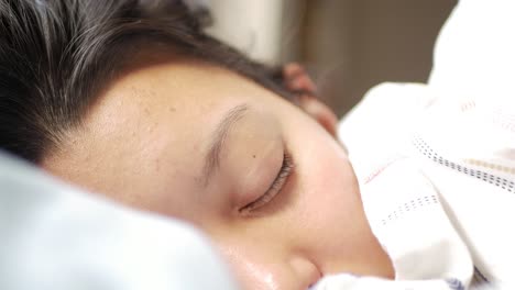 Close-Up-Young-Woman-Waking-Up-Early