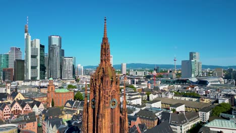 4k aerial drone video of the clock tower of the historic kaiserdom st. bartholomäus church in downtown frankfurt, germany