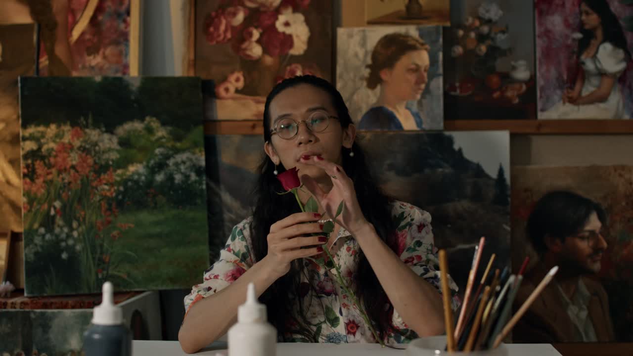 Artist in Studio with Paintings