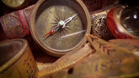 vintage style travel and adventure. vintage old compass and other vintage items on the table.