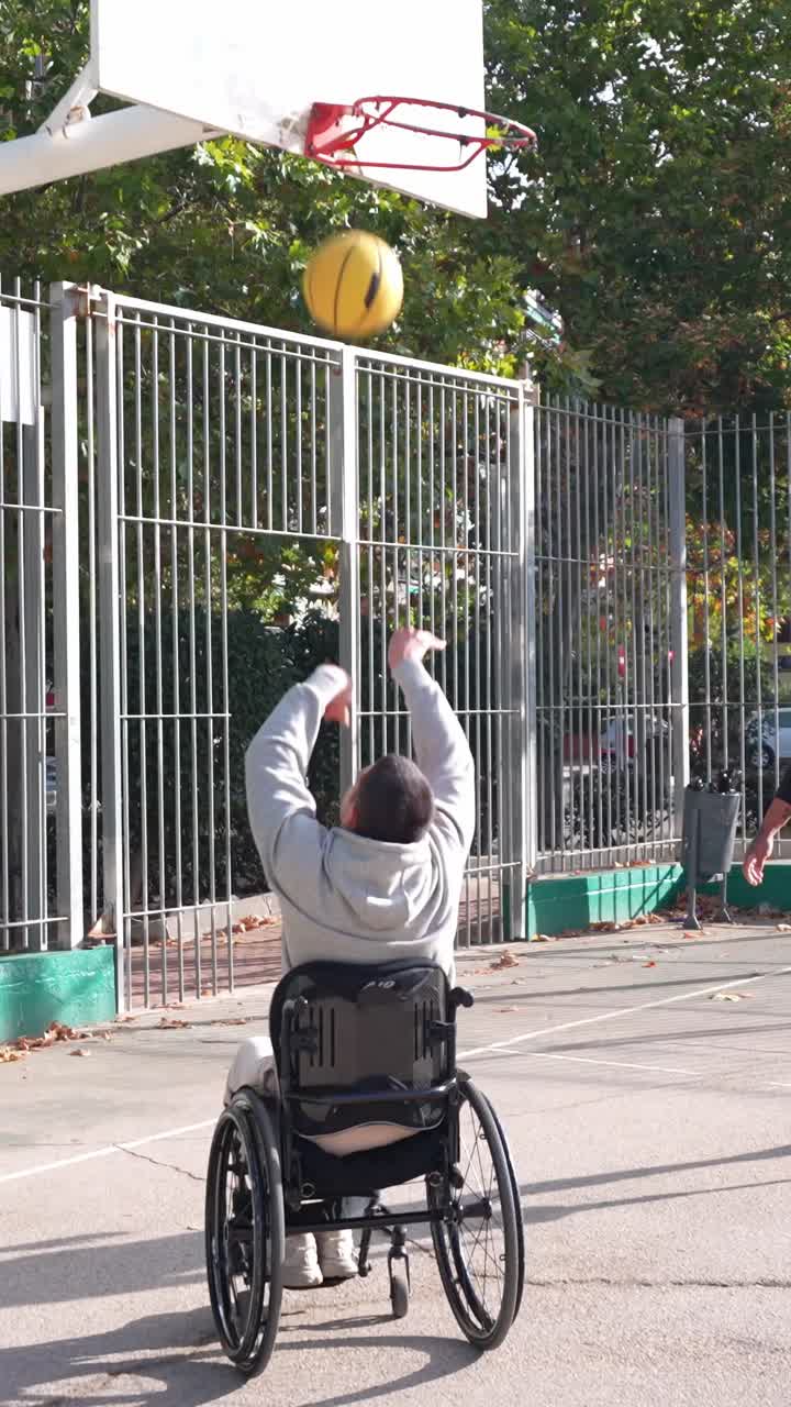 Two Men with Disabilities Playing Basketball on an Outdoor Court