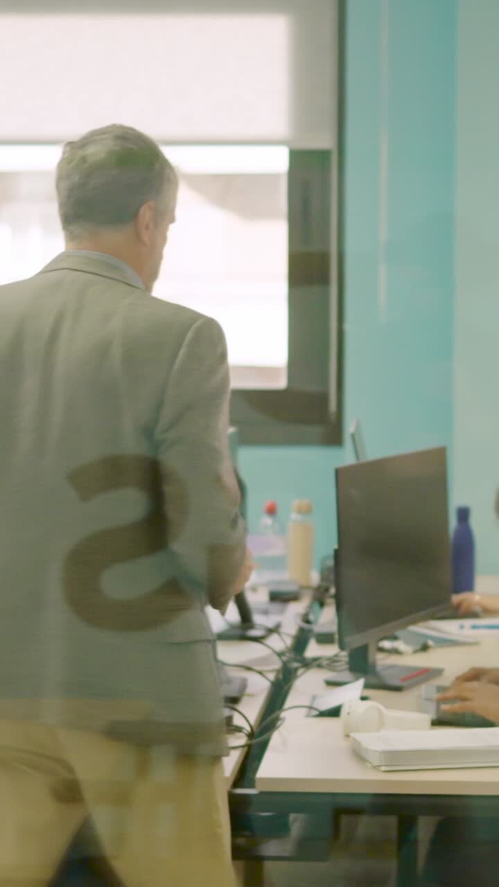 Man delivering files to employees in a coworking space