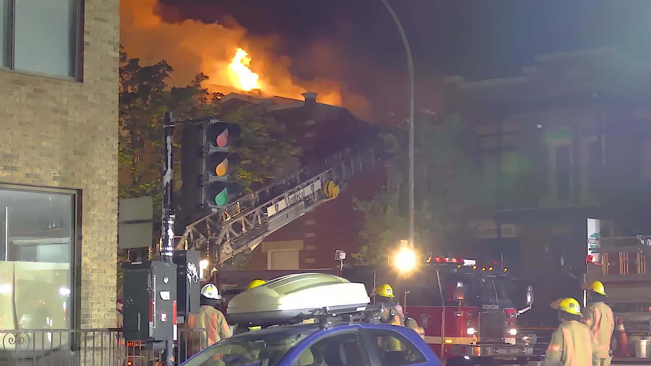 Firefighters Battle Intense Building Fire at Night