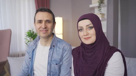 Smiling-Muslim-family-looking-at-camera.