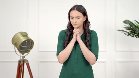 Afraid-Indian-girl-praying-to-god