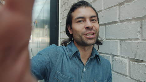 Man taking a selfie in the city