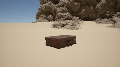 old suitcase abandoned in the desert