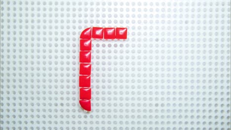 stop motion of the letter o creating one pixel at the time, made with children toys