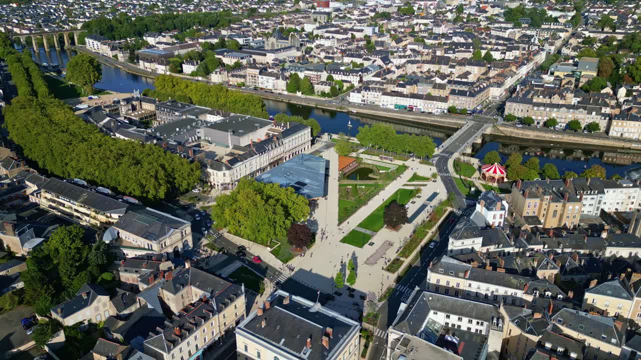 Place du 11 Novembre, new square in Laval, Mayenne river at sunset. Aerial drone lateral