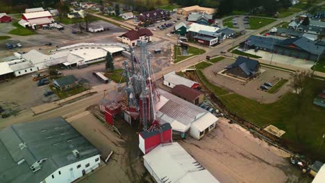 drone captures an industrial plant and adjacent warehouses at factory complex in south america, showcasing the large-scale infrastructure, with rows of buildings, machinery, and storage areas