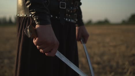 a cossack with two sabres in his hands looks into the distance at the enemy 02