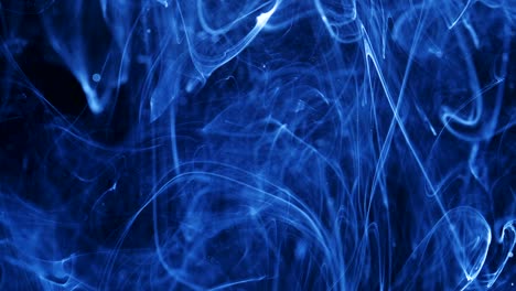 shot of ink moves. cosmic abstraction of a light blue particle ink. macro