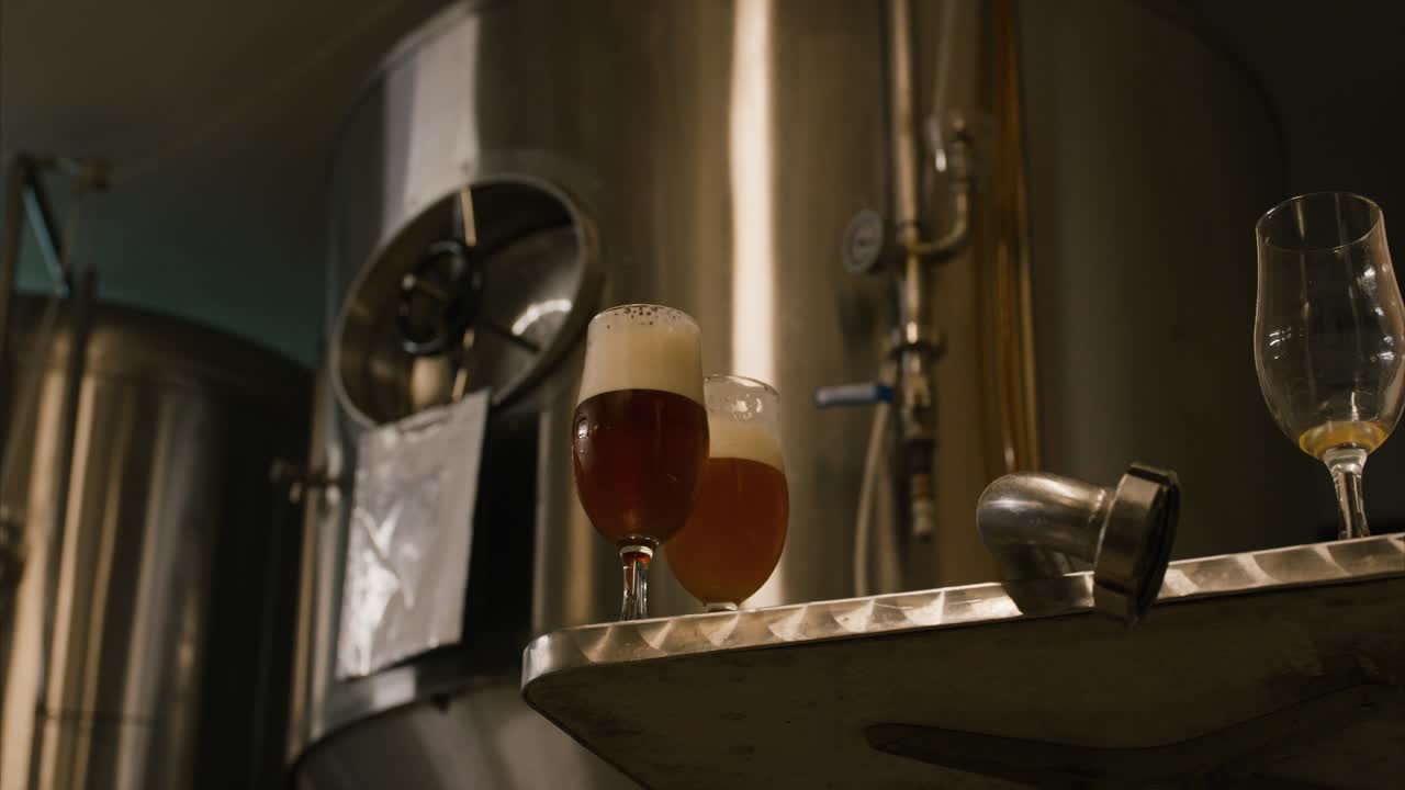 beer in a glass during tasting in a brewery pan right zoom in movement slow mo