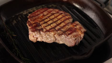 grilled ribeye steak in a cast iron pan