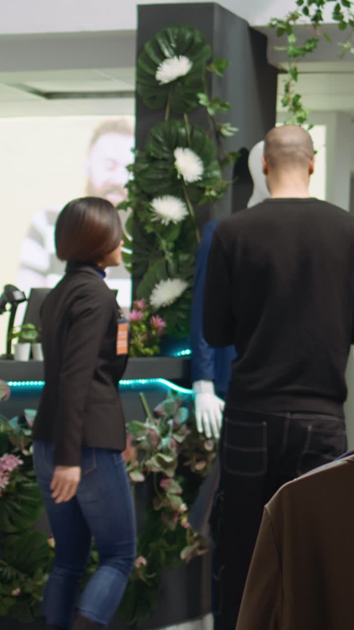 People shopping for suits in a retail setting