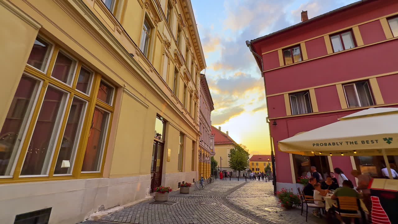Sibiu, Romania, 1 July 2025: Evening Street with Cafes in Sibiu. Colorful evening street in Sibiu, Romania, with cafes and restaurants creating a lively atmosphere for locals and tourists