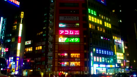 night lapse with japanese neons at shinjuku south side wide shot zoom in