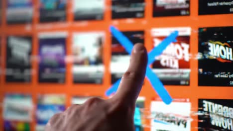 a close-up view of a hand interacting with a glitched digital screen, highlighting the process of selection and dismissal in a dynamic visual interface