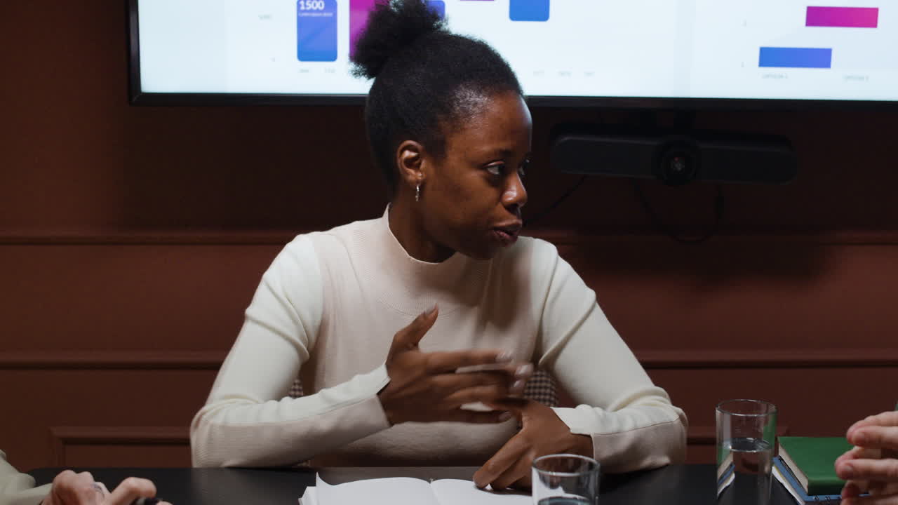 Professionals Discussing Data and Strategy in a Business Meeting