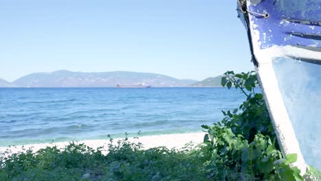 coastal scenery with boat and mountains