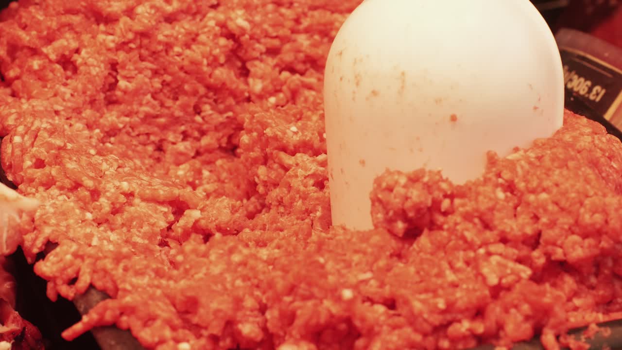 Fresh ground beef for cooking delicious and healthy food on wooden background top view. High quality 4k footage