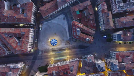 amazing evening view of a children's carousel in montpellier france. aerial