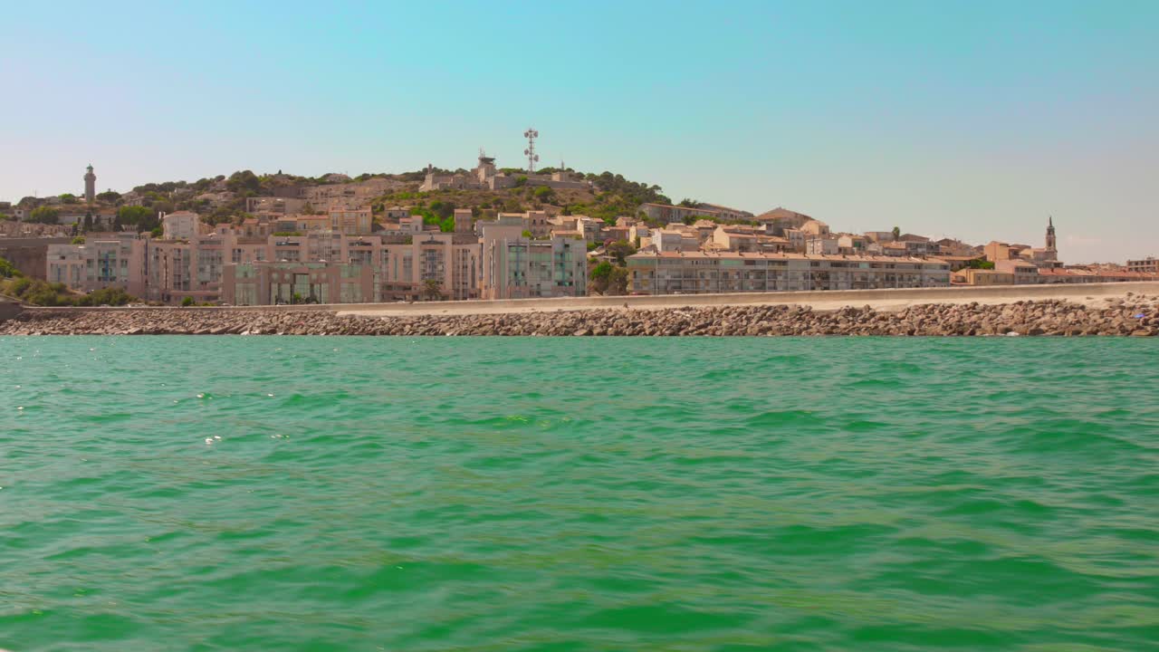 Scenic coastal view of Sète, France with tranquil sea and clear sky