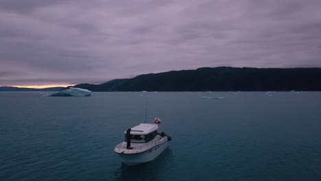 Aerial-of-a-motorboat-in-ice-water-by-a-giant-icecap