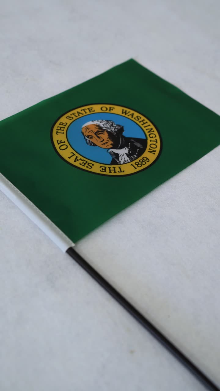 Washington state flag. Vertical shot on white background