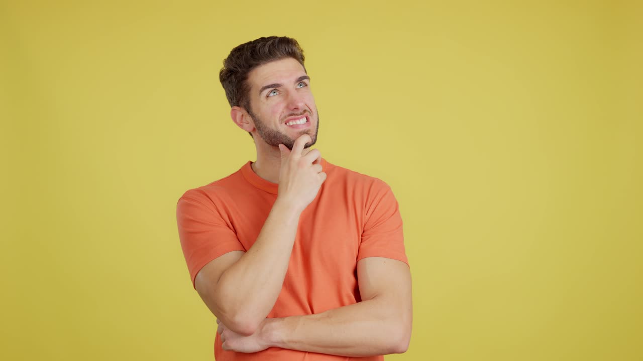 Man Thinking with a Confused or Skeptical Expression on a Yellow Background
