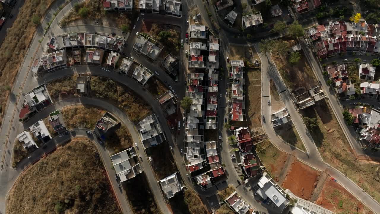 DRONE: TOP-DOWN VIEW OF ZAPOPAN, JALISCO CITY AT A SUNNY SUNSET