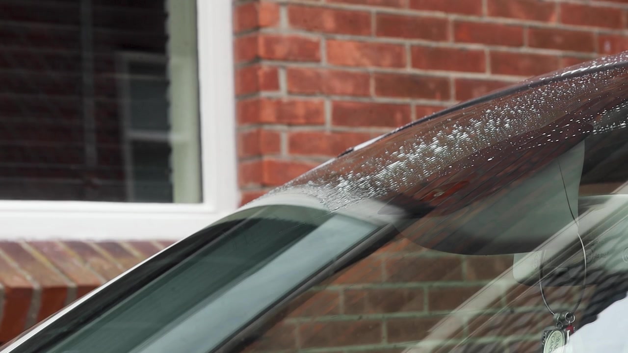 Video of washer fluid being used with windshield wipers.