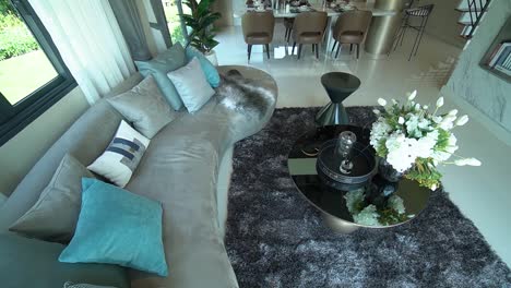 Elegant-Grey-Velvet-Long-Sofa-With-Pillow-and-Golden-Coffee-Table-and-Vase-In-Living-Area,-No-People