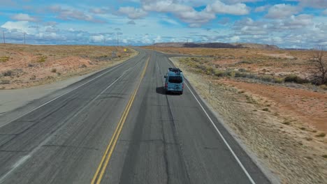 following a van driving through the asphalt road in arizona, usa