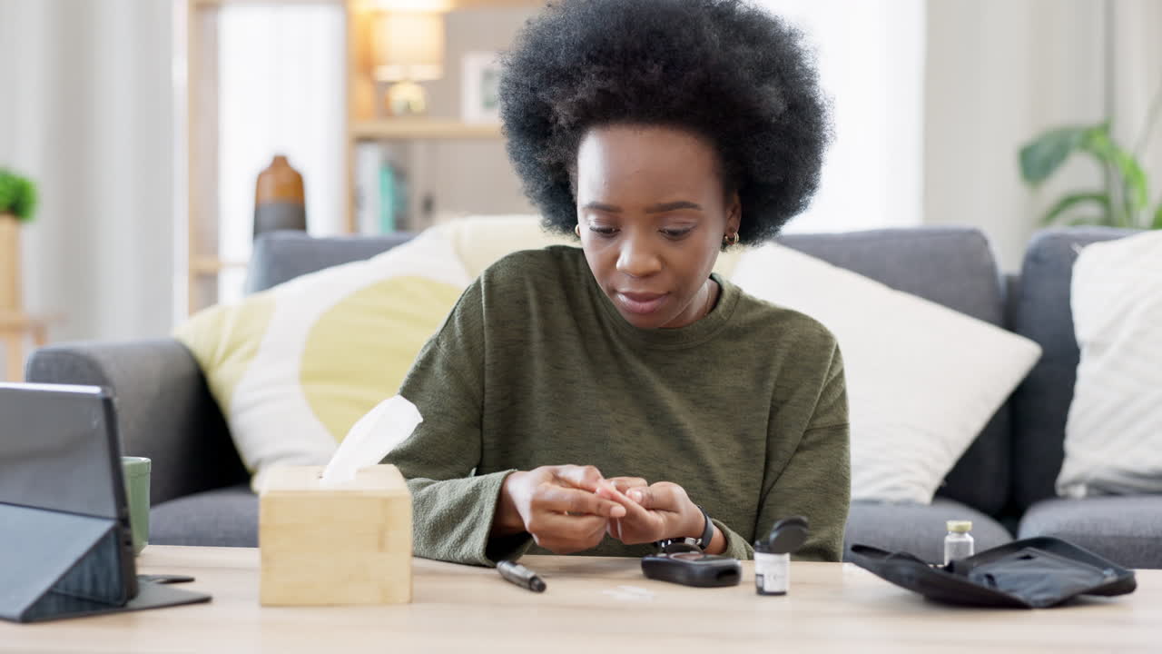 Black woman doing glucose monitoring at home