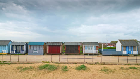 Behold-the-splendor-of-Mablethorpe-from-the-skies,-an-East-Coast-holiday-town-in-Lincolnshire,-with-aerial-shots-of-beach-huts,-sandy-beaches,-and-lively-amusement-parks-with-tourists
