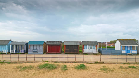 behold the splendor of mablethorpe from the skies, an east coast holiday town in lincolnshire, with aerial shots of beach huts, sandy beaches, and lively amusement parks with tourists