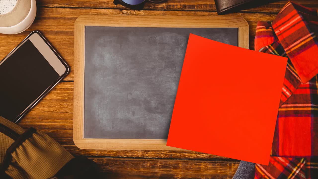 Animation of memo note with copy space over chalkboard on desk