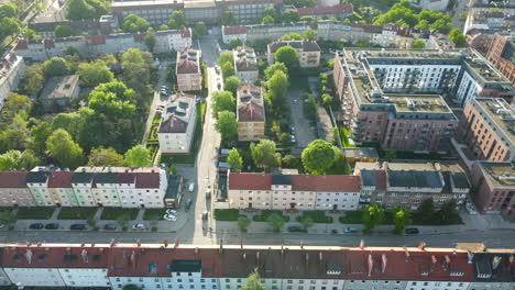 aerial flyover residential neighborhood in gdansk with housing complex during sunny day