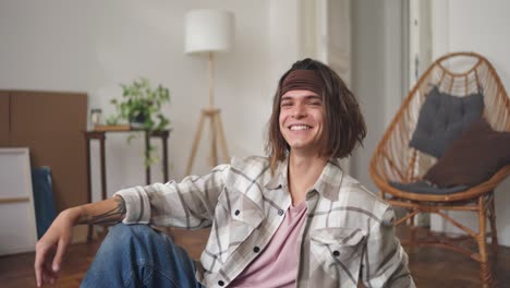 happy young man in a cozy living room