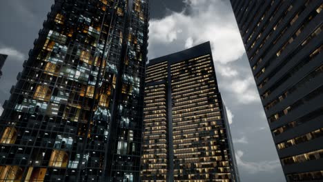 glass skyscrpaer office buildings with dark sky