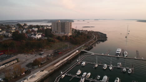 drone shot above marina in portland maine, morning soft light