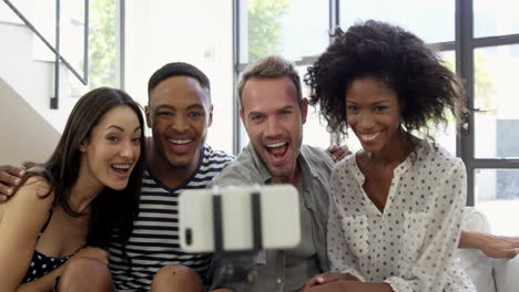 multi-ethnic friends smiling and taking selfie