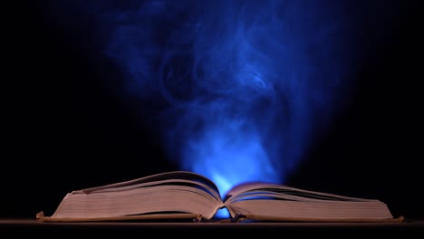 mystical open book with blue light
